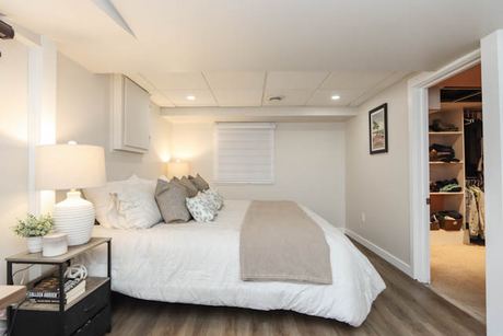 Bedroom with white bedding and nightstands