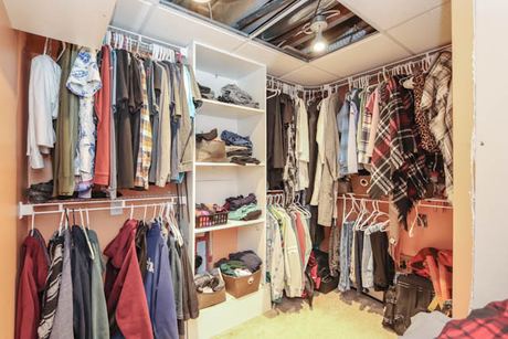 Walk-in closet with open shelving and hanging rails